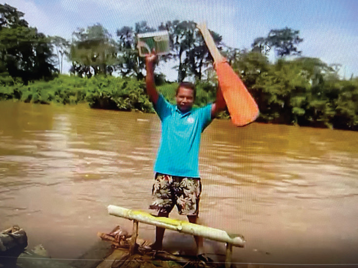 Pastor Plutario on his raft heading for SOC Conference in Nicaragua